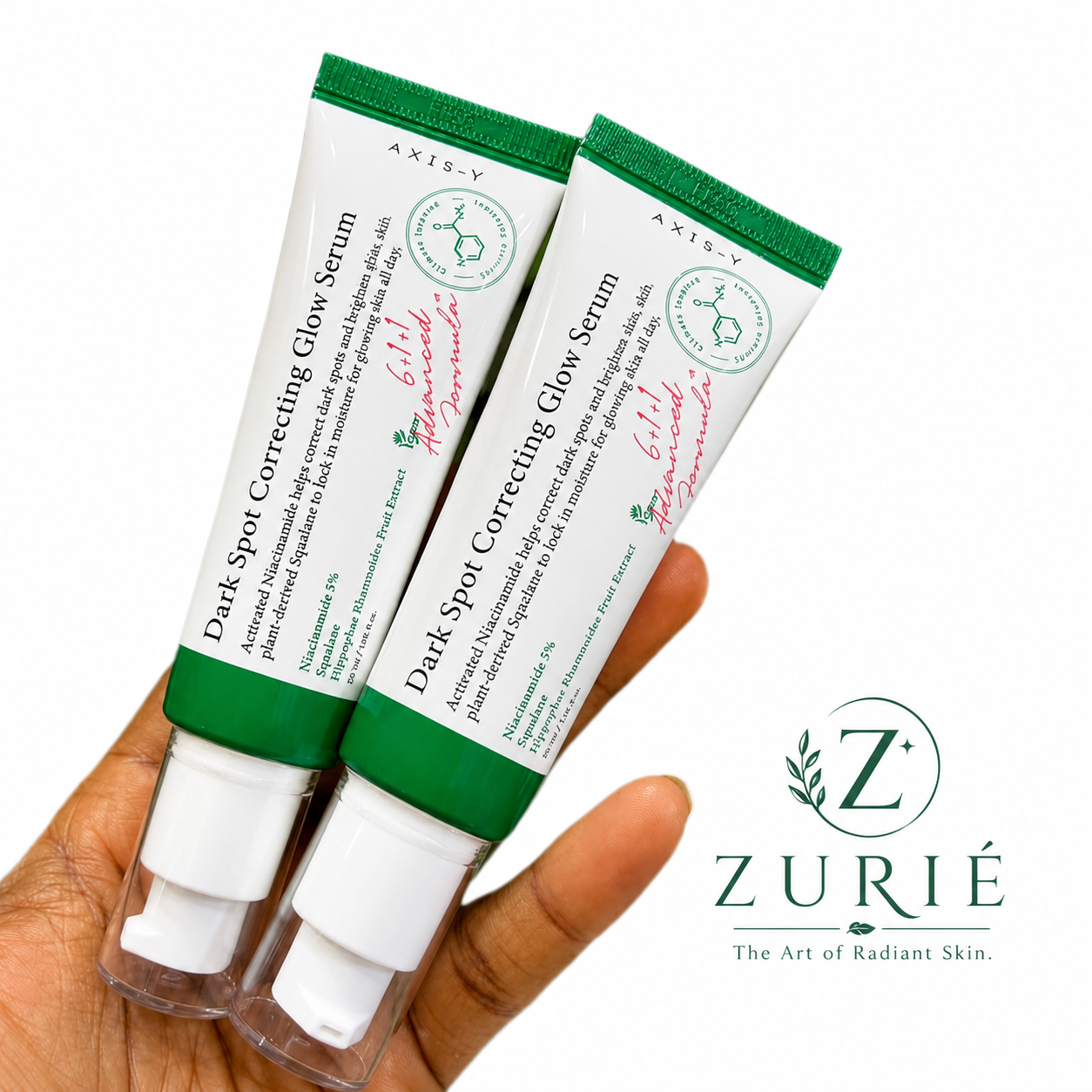 Two Axis Y Dark Spot Correcting Glow Serum tubes held in hand